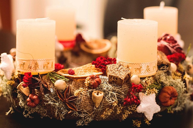 luxury candle jars and reed diffusers styled on a marble tray with warm amber light